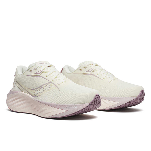 These women's running shoes are a white color with a tiny bit of yellow in the white threads.