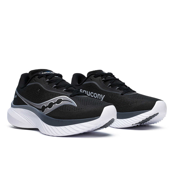 This pair of Saucony shoes are mostly black with a white midsole.