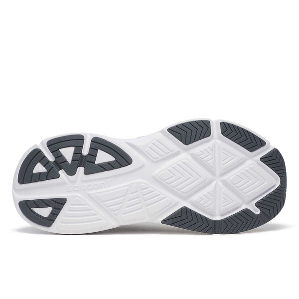 White athletic shoe with black sole on a white background