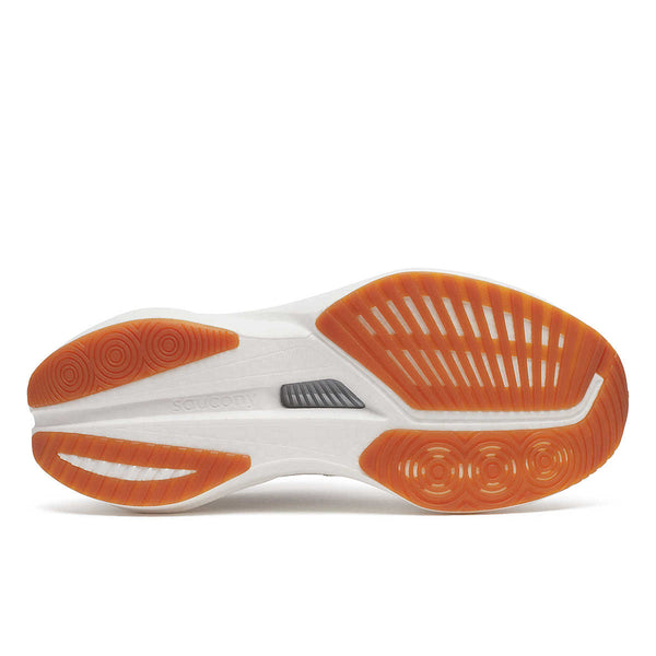 Close-up of a shoe sole with gum sole colors and white design on a white background.