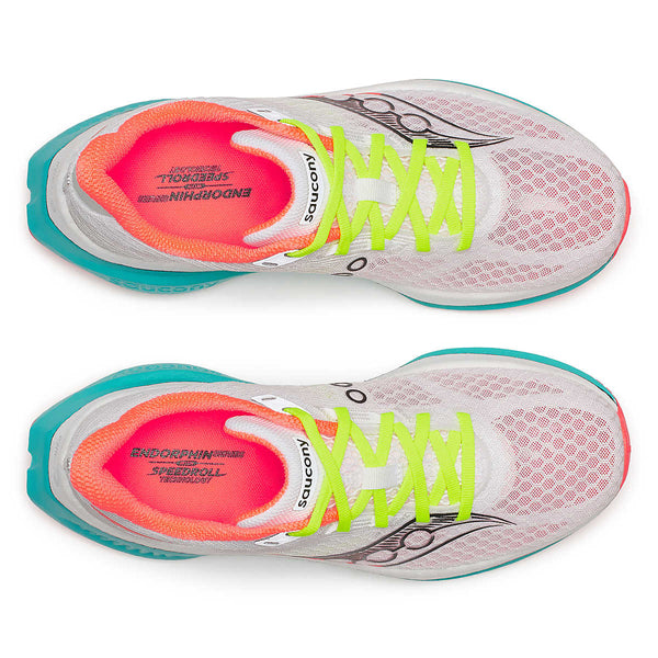 Top down view of a pair of  mens running shoes with colorful sole and white background.