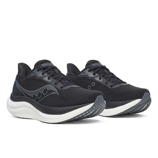 Pair of women's Saucony Triumph 23 black running shoes with white soles on a white background.