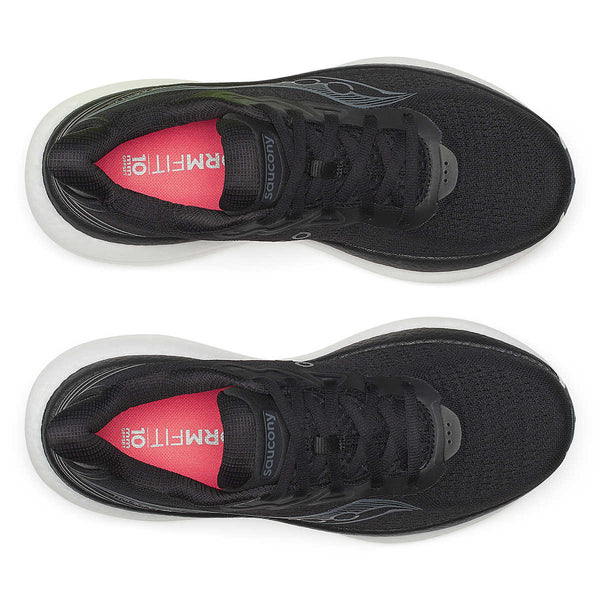 A pair of women's Saucony Triumph 23 black running shoes with a white sole on a white background.