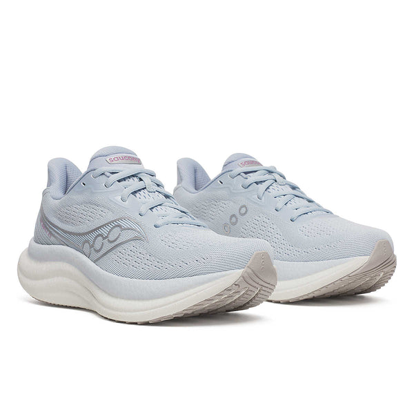 Pair of Triumph 23 light blue running shoes on a white background.