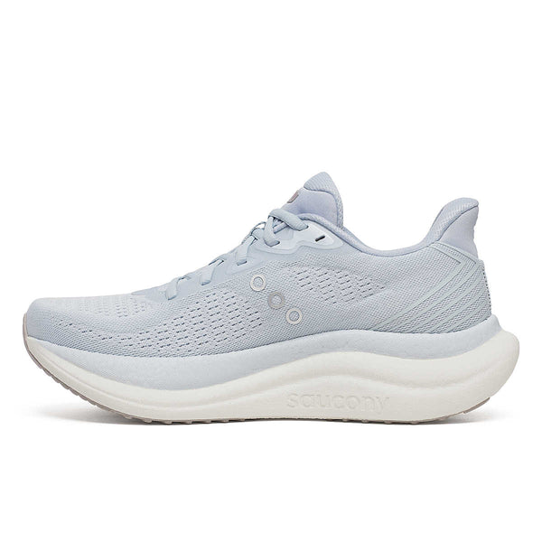 The medial side of a ight blue Saucony running shoe on a white background.