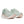 Pair of light green running shoes with pink soles on a white background