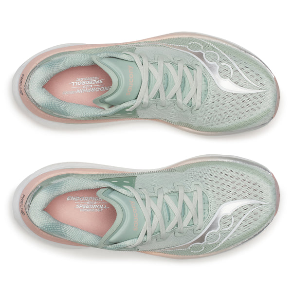 Pair of green and pink running shoes on a white background
