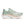 Light green running shoe with a white sole on a white background