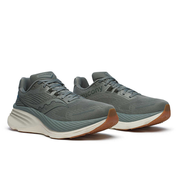 This pair of Saucony shoes have an off white midsle and grey/greenish upper.