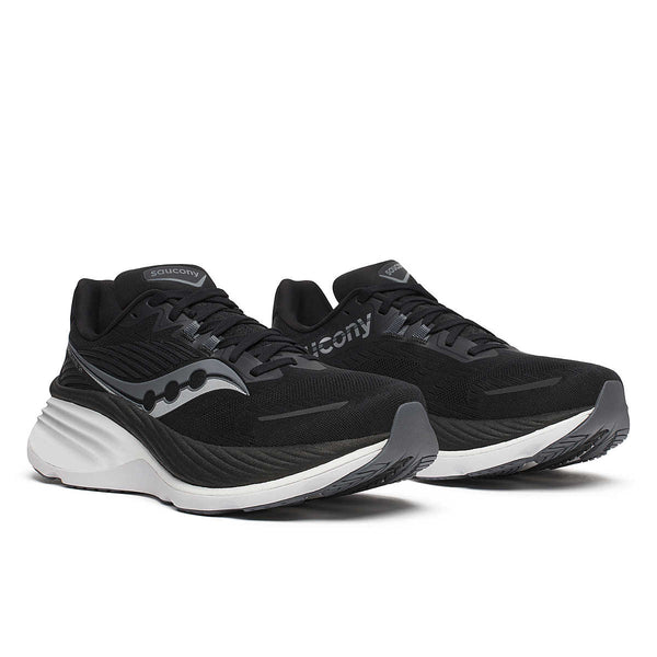 This pair of running shoes is all black and white.