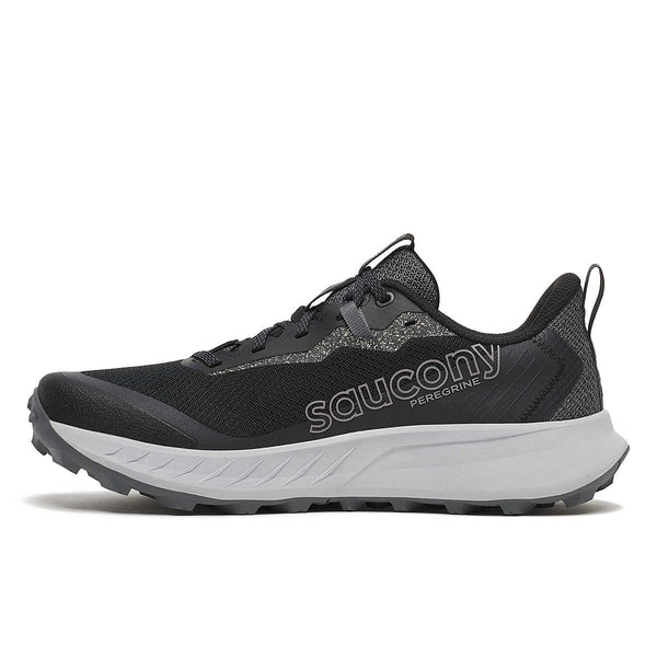 Medial side of a blck Saucony trail running shoe on a white background.
