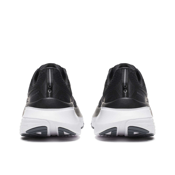 The heel of thes Saucony black and white running shoes with white soles on a white background.