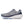The medial side of a gray and blue running shoe with white sole on a white background.