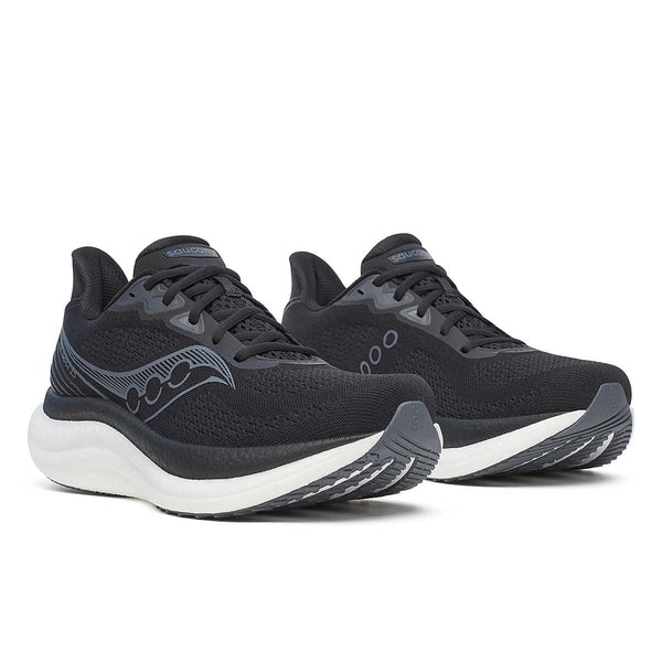 Pair of black running shoes with white soles on a white background.