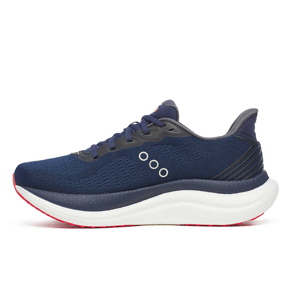 The medial side of a blue running shoe with white sole on a white background.