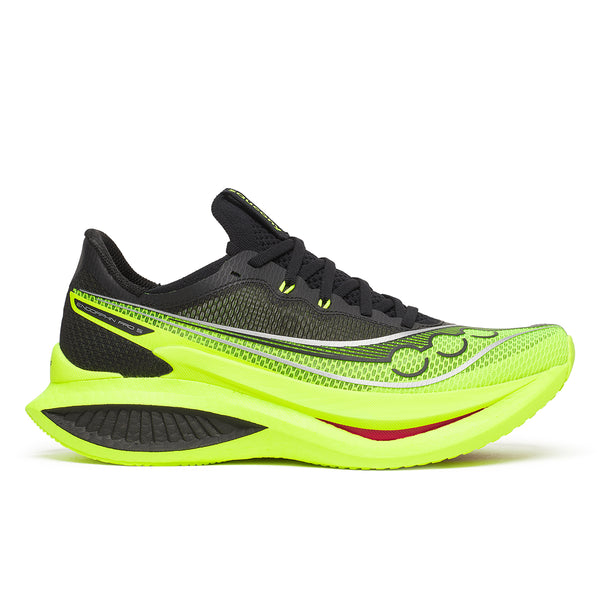 Black and neon green running shoe on a white background