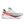 White running shoe with colorful sole on a white background