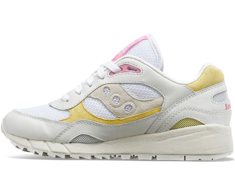Medial view of the Women's Shadow 6000 by Saucony in the color White/Yellow/Pink