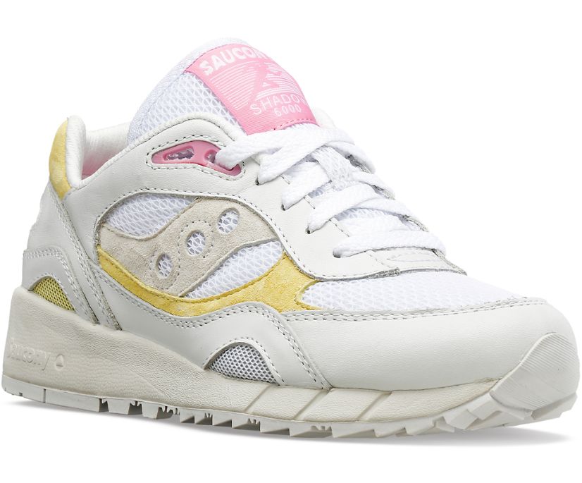 Front angle view of the Women's Shadow 6000 by Saucony in the color White/Yellow/Pink