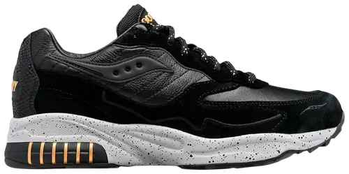 Black and gray sneaker with gold accents on a white background