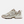 A New Balance athletic sneaker in beige, white, and brown, shown against a plain white background.