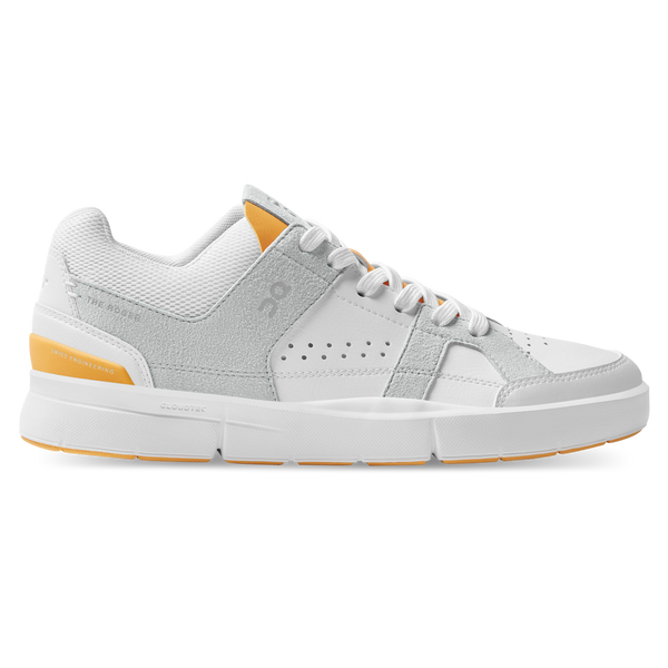 Gray and white sneaker with orange accents on a white background