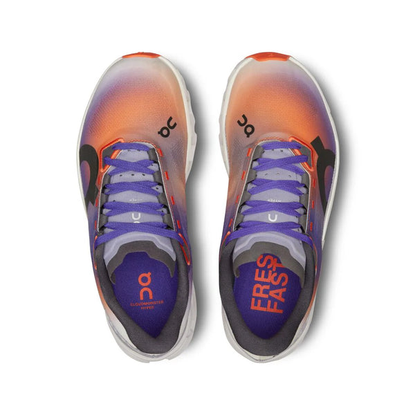 Pair of colorful running shoes with visible branding on a white background