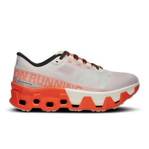 A women's white running shoe with orange sole on a white background.
