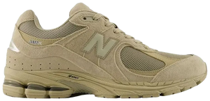 Beige running shoe with New Balance logo on a white background