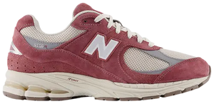 Maroon running shoe with white accents on a white background