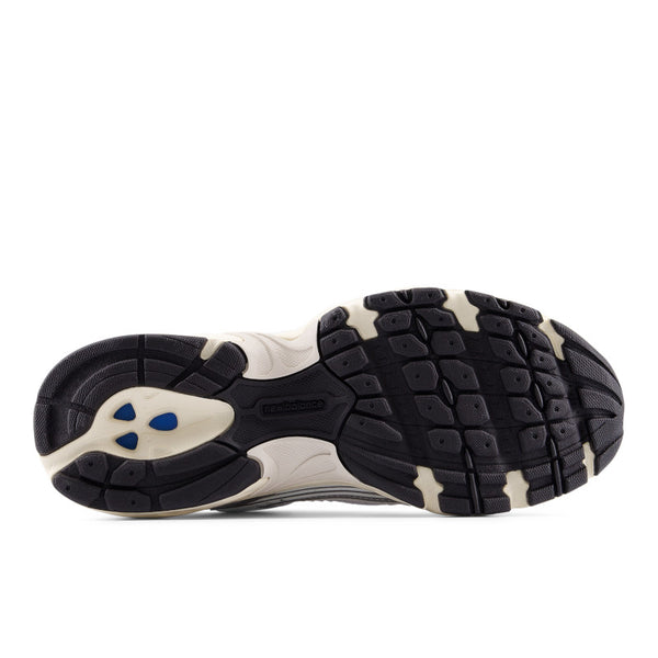 Sole of a black and white athletic shoe on a white background