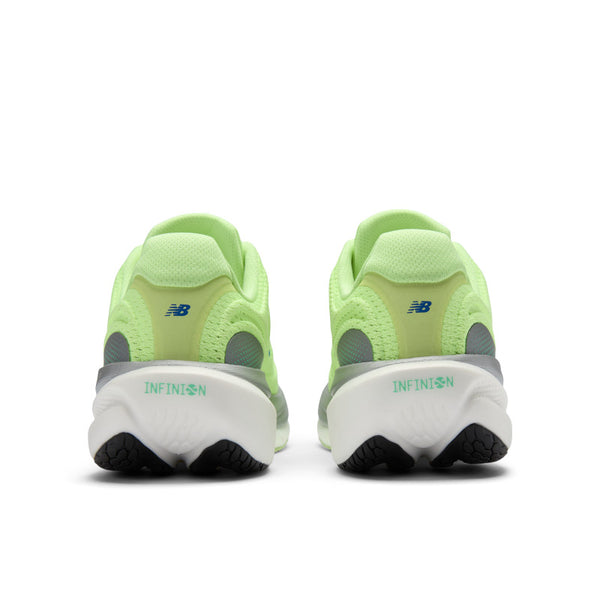 The heel of a pair of green running shoes with 'New Balance' logo on a white background and the words infinion near the heel.