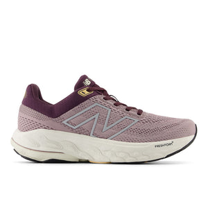 A purple New Balance women's running shoe with a mesh upper and a sole visible in a gray hue.