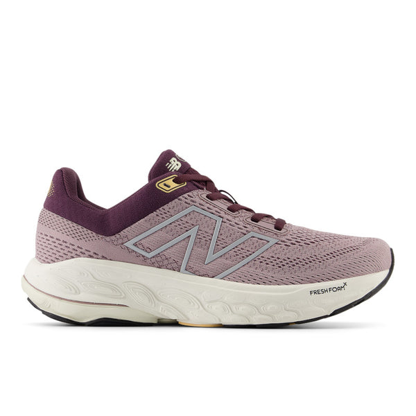 A purple New Balance women's running shoe with a mesh upper and a sole visible in a gray hue.