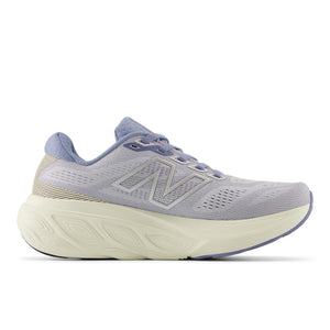 This image displays the Women's 880 V15, a stylish and modern sneaker designed for both comfort and performance. The shoe features a soft purple hue with subtle patterns and details, and incorporates a neutral beige color on the sole.