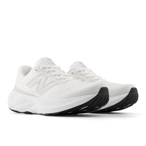 The laces and upper of this running shoe are all white, but the outsole is black.