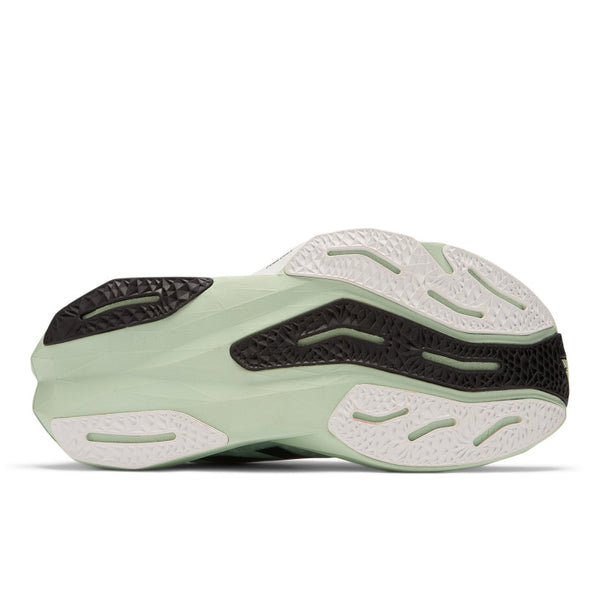 The outsole of the Rebel V4 for women is a light green color with a bit of black adn white.