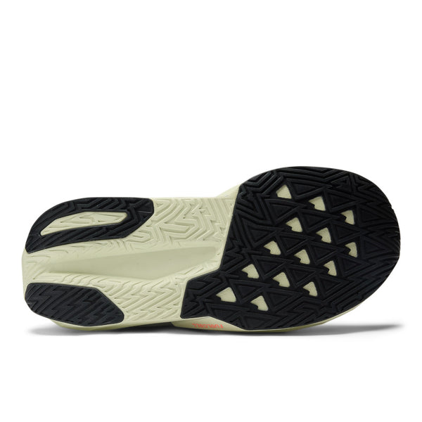 Close-up of a shoe sole with black and beige pattern on a white background