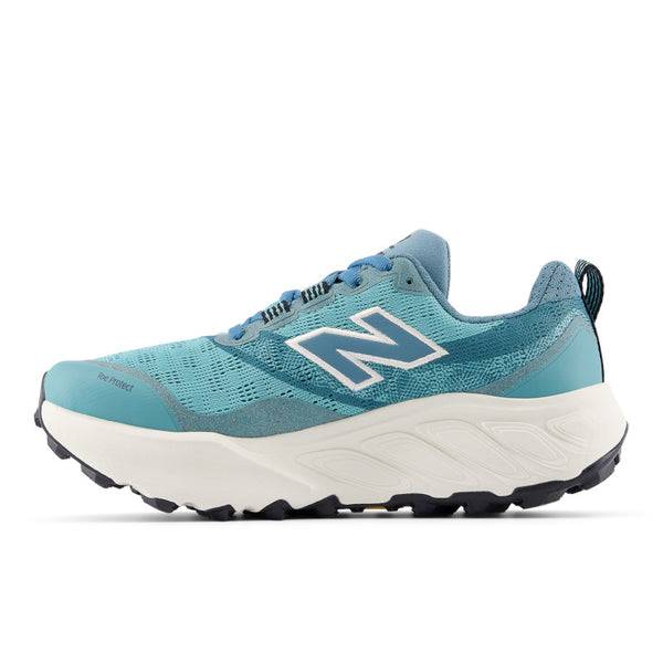 Blue running shoe with white sole on a white background