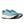 A paior of new balance light teal running shoe with white sole on a white background.