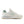 Beige sneaker with green accents on a white background