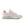 White 574 sneaker with pink accents on and a pink heel tab.