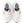 The eylets of this women's NB running shoe have bright orange pops of color.