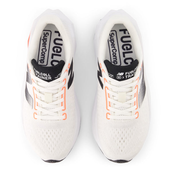 The eylets of this women's NB running shoe have bright orange pops of color.