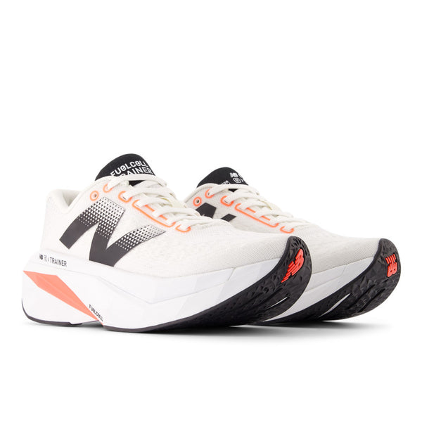 Women's New Balance running shoe with carbon and a black tongue.