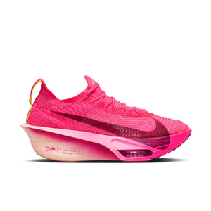 Pink sneaker with a gradient sole on a white background