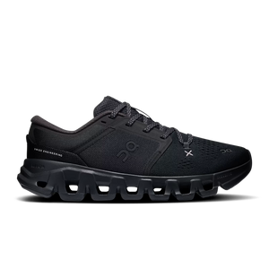 A black On running shoe with a chunky, hollowed-out sole, shown in a side profile view against a white background.
