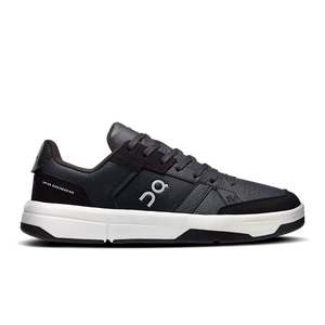 Black sneaker with white sole on a white background