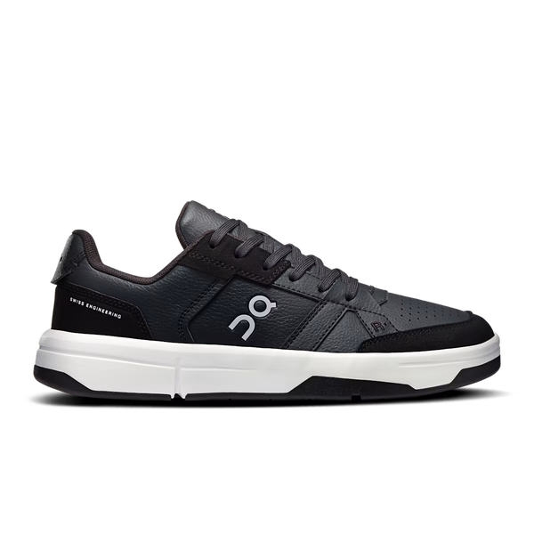 Black sneaker with white sole on a white background