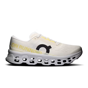 White running shoe with yellow accents on a white background